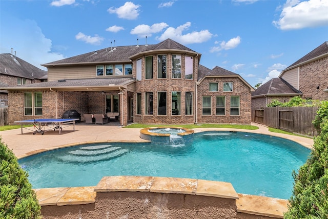 5434 Lockwood Bend Ln, Sugar Land, TX 77479 - view of swimming pool with a fenced backyard, a patio area, a pool with connected hot tub, an outdoor living space, and a grill