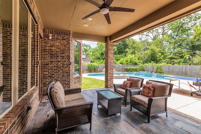 5434 Lockwood Bend Ln, Sugar Land, TX 77479 - fenced backyard featuring ceiling fan, an outdoor hangout area, and a patio