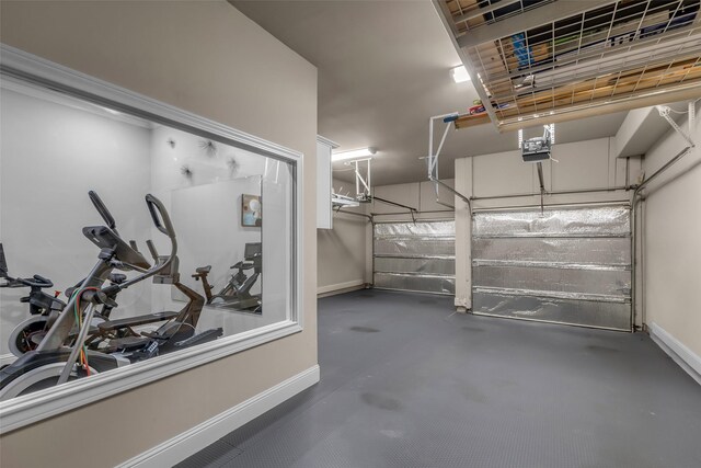 5434 Lockwood Bend Ln, Sugar Land, TX 77479 - garage featuring baseboards and a garage door opener