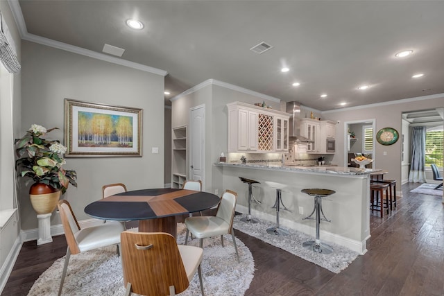 5434 Lockwood Bend Ln, Sugar Land, TX 77479 - dining space with ornamental molding, recessed lighting, and dark wood-type flooring