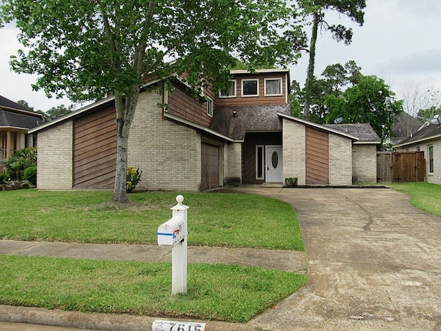 7615 Pine Hollow Dr, Humble, TX 77396 - mid-century inspired home with concrete driveway, brick siding, and an attached garage