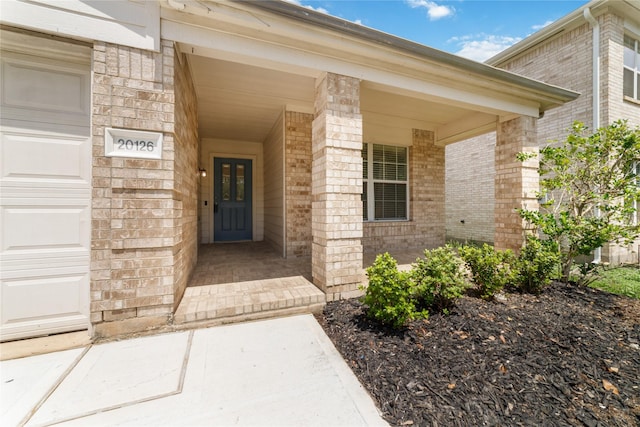 20126 Cypresswood Gln, Spring, TX 77373 - doorway to property featuring brick siding and a garage