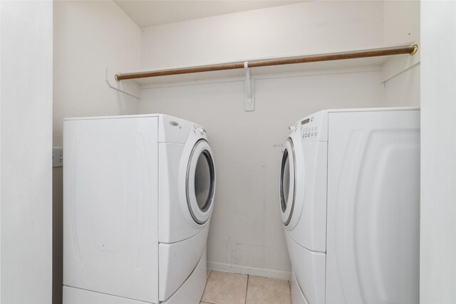 20126 Cypresswood Gln, Spring, TX 77373 - laundry room featuring separate washer and dryer and light tile patterned floors