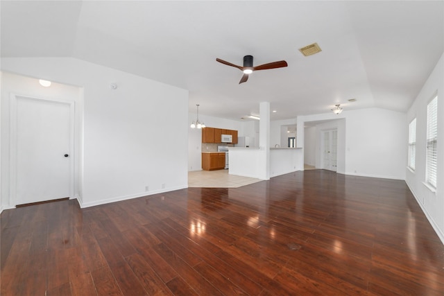 20126 Cypresswood Gln, Spring, TX 77373 - unfurnished living room featuring lofted ceiling, ceiling fan, light wood-style flooring, and a chandelier