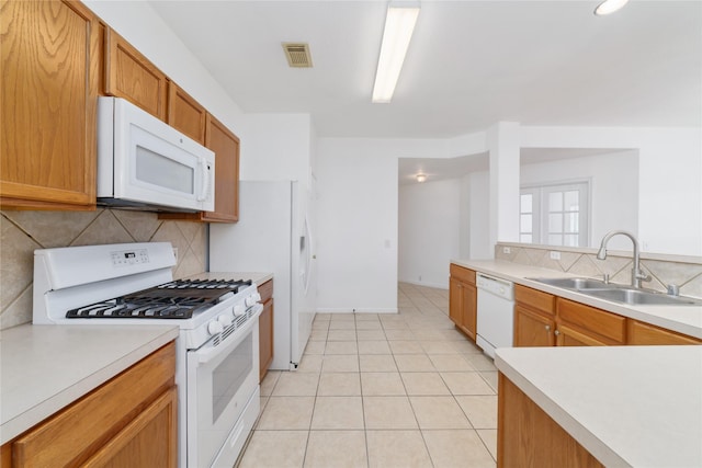 20126 Cypresswood Gln, Spring, TX 77373 - kitchen with white appliances, decorative backsplash, light countertops, and light tile patterned floors