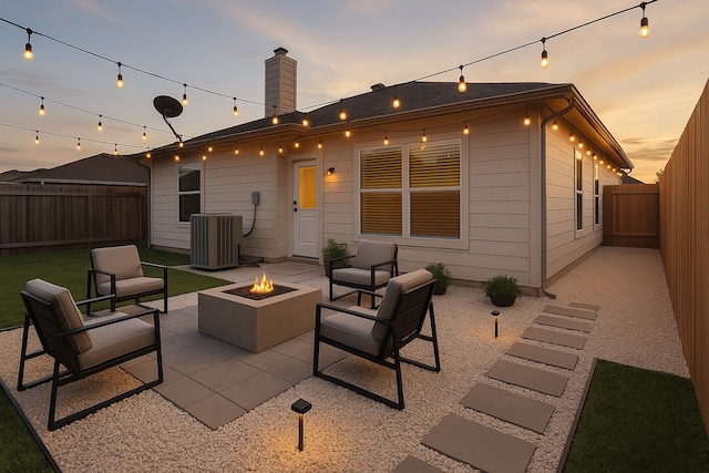 20126 Cypresswood Gln, Spring, TX 77373 - patio terrace at dusk with a fire pit and a patio