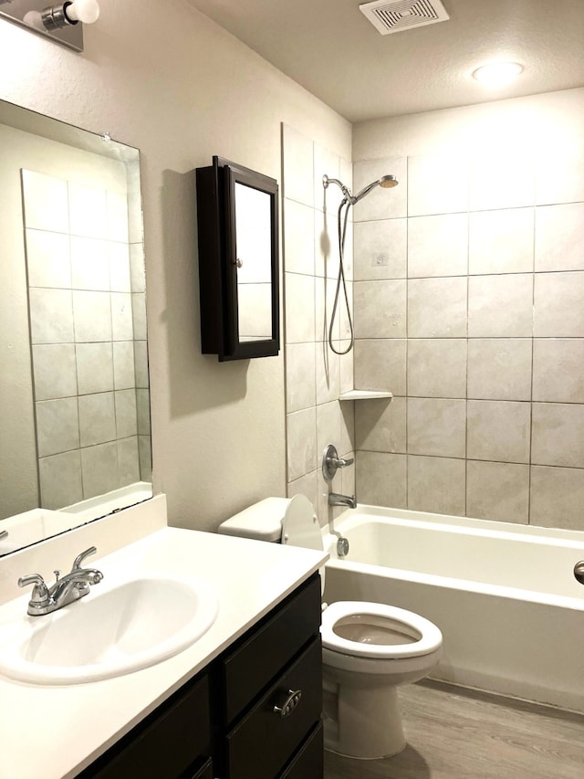 15806 Perthshire Creek Dr, Humble, TX 77346 - full bathroom featuring wood finished floors, vanity, and shower / bath combination