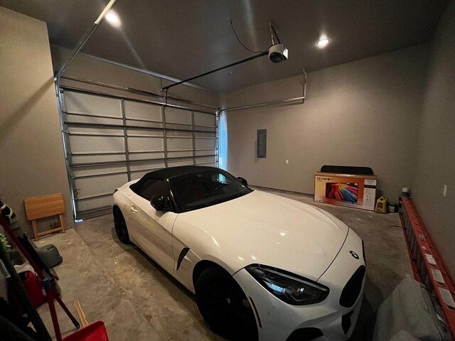9737 Fabiola Dr, Houston, TX 77075 - garage featuring a garage door opener and electric panel