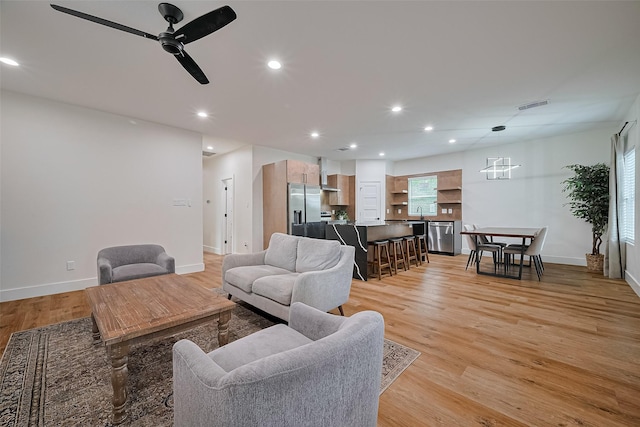 2015 Creston Dr, Houston, TX 77026 - living area with light wood-style floors, recessed lighting, and ceiling fan