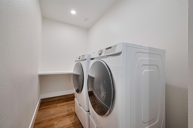 2015 Creston Dr, Houston, TX 77026 - washroom with separate washer and dryer, wood finished floors, and recessed lighting