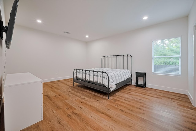 2015 Creston Dr, Houston, TX 77026 - bedroom with light wood-type flooring and recessed lighting