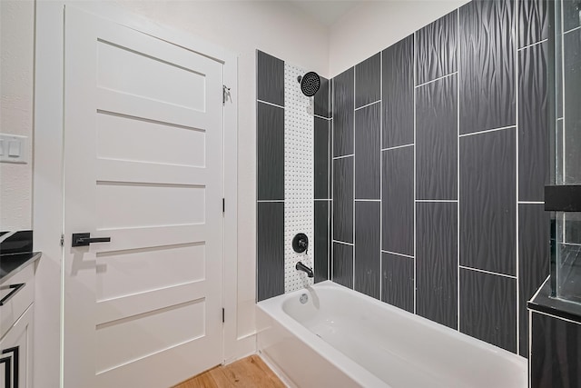 2015 Creston Dr, Houston, TX 77026 - full bathroom featuring shower / bathtub combination and wood finished floors