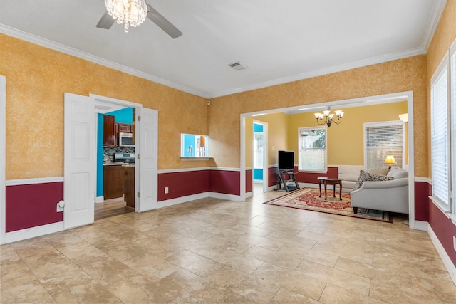 5602 Society Ln, Houston, TX 77084 - spare room featuring healthy amount of natural light, a chandelier, ceiling fan, crown molding, and light stone finish flooring