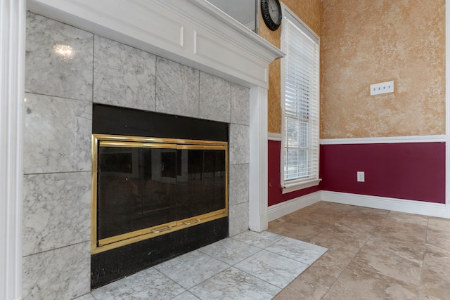5602 Society Ln, Houston, TX 77084 - detailed view of baseboards and a tile fireplace