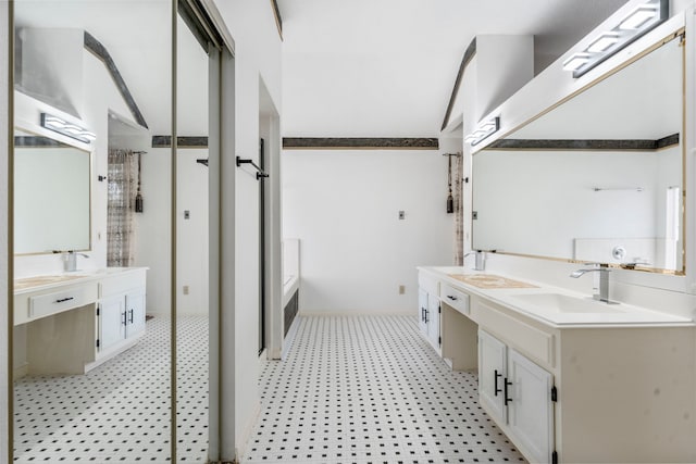 5602 Society Ln, Houston, TX 77084 - bathroom featuring a garden tub, double vanity, tile patterned floors, and a shower stall