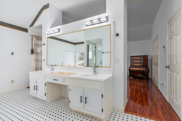 5602 Society Ln, Houston, TX 77084 - full bath with vaulted ceiling, double vanity, and tile patterned floors
