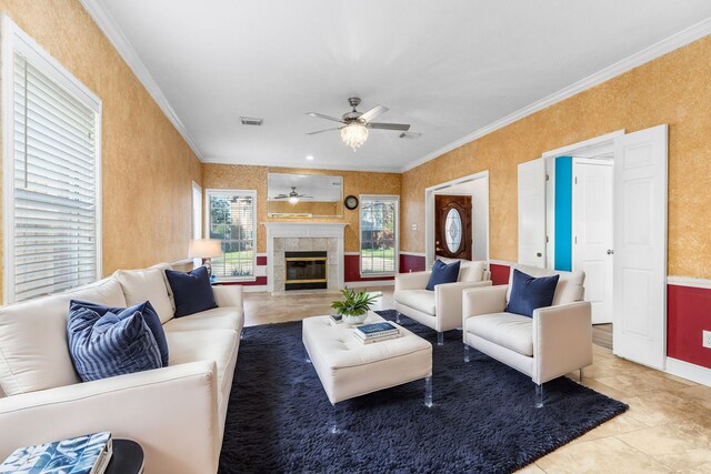 5602 Society Ln, Houston, TX 77084 - tiled living room with ceiling fan, ornamental molding, and a fireplace