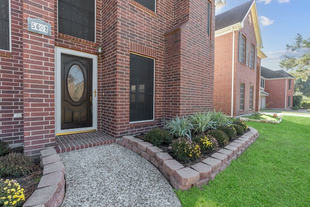 5602 Society Ln, Houston, TX 77084 - entrance to property with brick siding and a yard