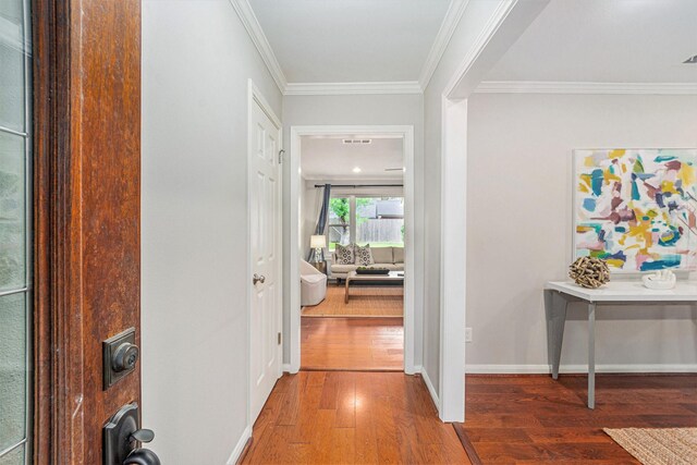 2535 Rosefield Dr, Houston, TX 77080 - hallway featuring wood-type flooring and crown molding