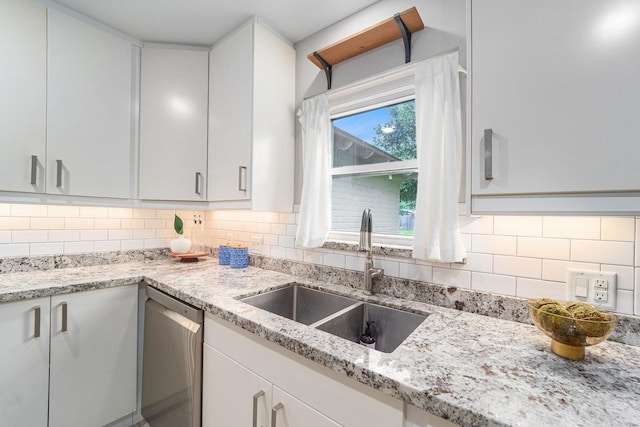 2535 Rosefield Dr, Houston, TX 77080 - kitchen with dishwasher, light stone counters, tasteful backsplash, and white cabinets