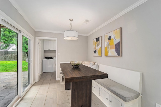 2535 Rosefield Dr, Houston, TX 77080 - dining room with washing machine and clothes dryer and ornamental molding