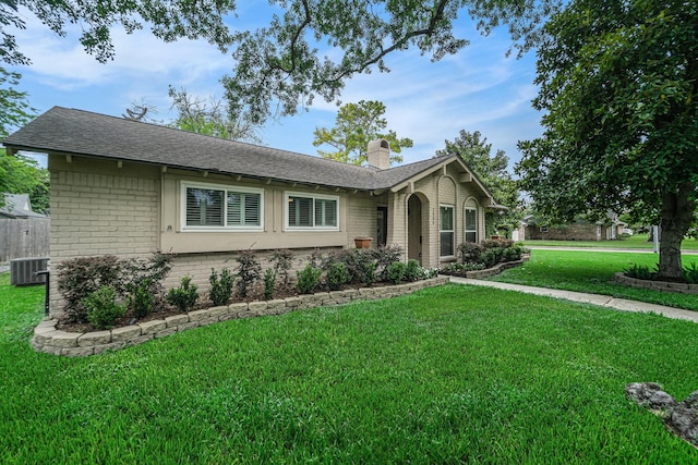 2535 Rosefield Dr, Houston, TX 77080 - ranch-style house featuring brick siding, a chimney, a front lawn, and roof with shingles