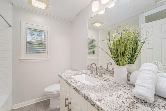 2535 Rosefield Dr, Houston, TX 77080 - full bathroom featuring wood finished floors, vanity, plenty of natural light, and shower / tub combination