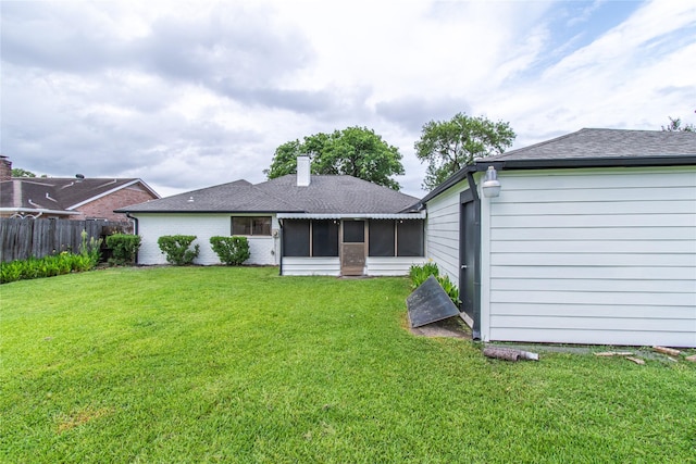 11523 Bandlon Dr, Houston, TX 77072 - back of house with a sunroom, a chimney, and roof with shingles