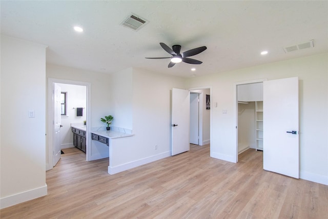 11523 Bandlon Dr, Houston, TX 77072 - unfurnished bedroom with recessed lighting, light wood-type flooring, a spacious closet, a ceiling fan, and ensuite bath