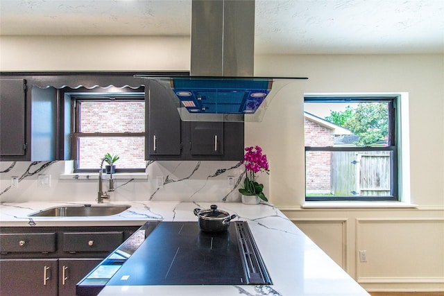 11523 Bandlon Dr, Houston, TX 77072 - kitchen featuring island exhaust hood, plenty of natural light, and decorative backsplash
