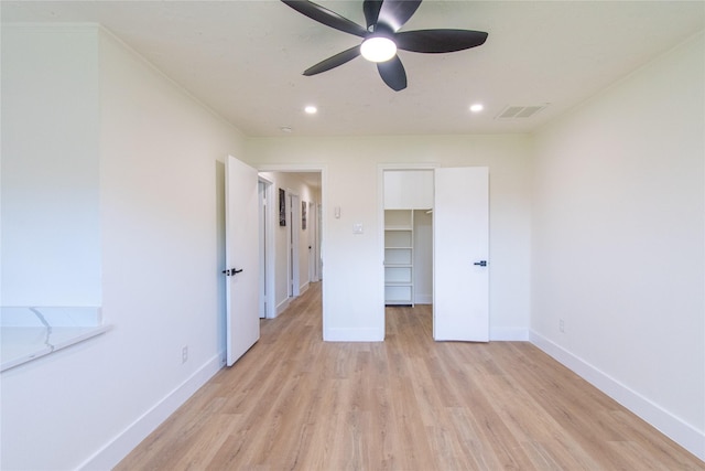 11523 Bandlon Dr, Houston, TX 77072 - unfurnished bedroom with light wood finished floors, a walk in closet, recessed lighting, and ceiling fan