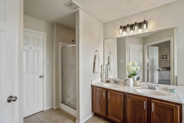 18605 Syndee Loch Ct, Spring, TX 77379 - bathroom with tile patterned floors, a stall shower, ensuite bathroom, and double vanity