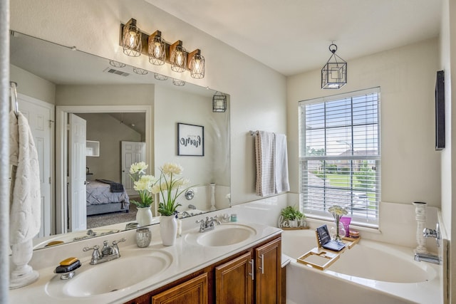18605 Syndee Loch Ct, Spring, TX 77379 - ensuite bathroom featuring a bath and double vanity