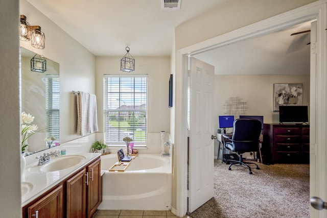 18605 Syndee Loch Ct, Spring, TX 77379 - bathroom with a garden tub and double vanity