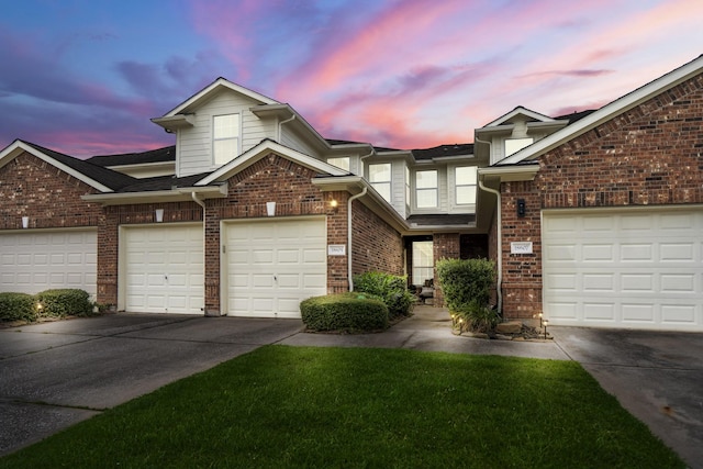18605 Syndee Loch Ct, Spring, TX 77379 - traditional home with an attached garage, concrete driveway, brick siding, and a front yard