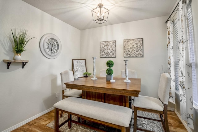 18605 Syndee Loch Ct, Spring, TX 77379 - dining area featuring wood finished floors and a chandelier