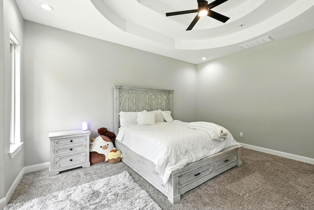 17114 Leon Ct, Splendora, TX 77372 - carpeted bedroom with recessed lighting, ceiling fan, and a tray ceiling