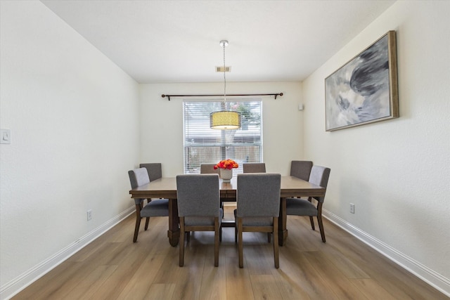 4206 Brazos Bend Dr, Pearland, TX 77584 - dining area with wood finished floors and baseboards