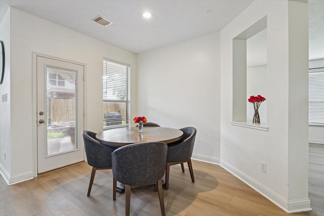 4206 Brazos Bend Dr, Pearland, TX 77584 - dining room with light wood finished floors and recessed lighting