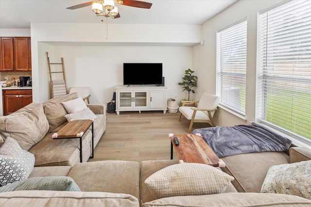 4206 Brazos Bend Dr, Pearland, TX 77584 - living area with light wood-style floors and ceiling fan