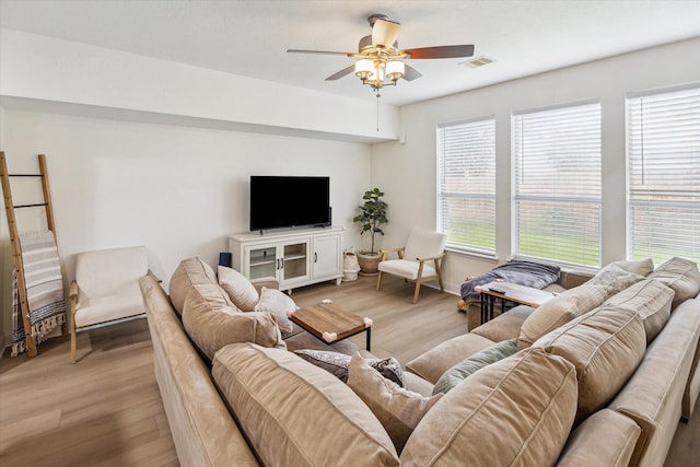4206 Brazos Bend Dr, Pearland, TX 77584 - living area featuring light wood finished floors and a ceiling fan