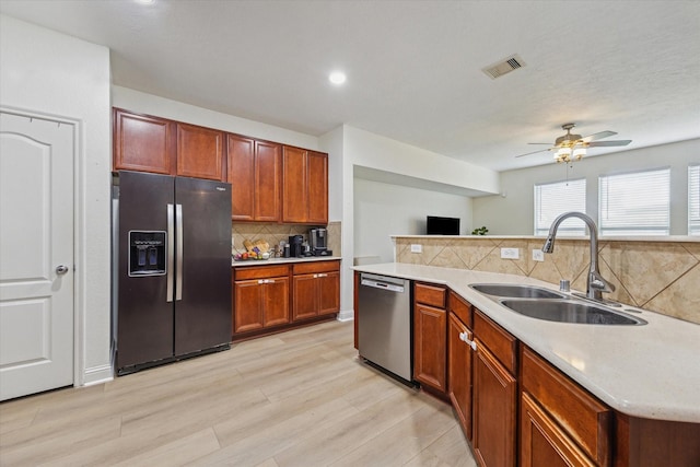 4206 Brazos Bend Dr, Pearland, TX 77584 - kitchen featuring fridge with ice dispenser, dishwasher, ceiling fan, decorative backsplash, and light countertops
