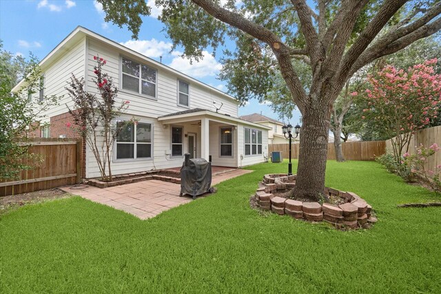 4206 Brazos Bend Dr, Pearland, TX 77584 - rear view of property with a fenced backyard and a patio