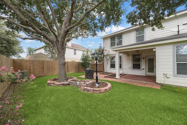4206 Brazos Bend Dr, Pearland, TX 77584 - fenced backyard featuring a patio area and ceiling fan