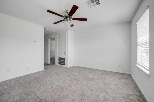 22351 Auburn Cabin Ln, Porter, TX 77365 - unfurnished room featuring attic access, a ceiling fan, healthy amount of natural light, and carpet flooring