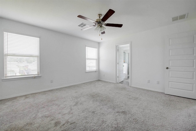22351 Auburn Cabin Ln, Porter, TX 77365 - unfurnished bedroom featuring carpet floors, ceiling fan, and ensuite bathroom