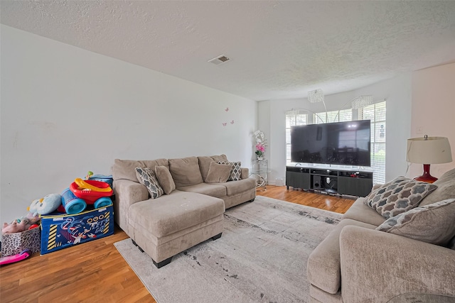 13351 Oak Leaf Ln, Houston, TX 77015 - living room featuring wood finished floors and a textured ceiling