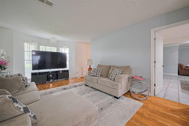 13351 Oak Leaf Ln, Houston, TX 77015 - living room with wood finished floors and a textured ceiling
