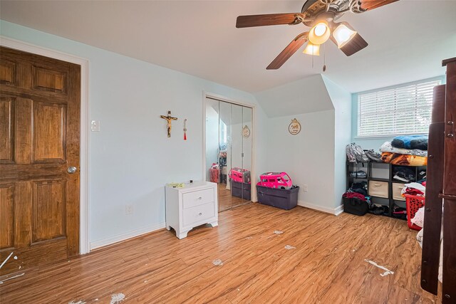 13351 Oak Leaf Ln, Houston, TX 77015 - bedroom with light wood-style flooring, lofted ceiling, ceiling fan, and a closet