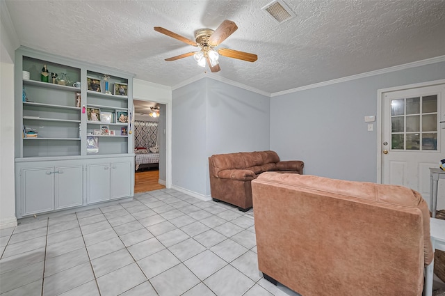13351 Oak Leaf Ln, Houston, TX 77015 - living room featuring a ceiling fan, light tile patterned floors, a textured ceiling, and crown molding